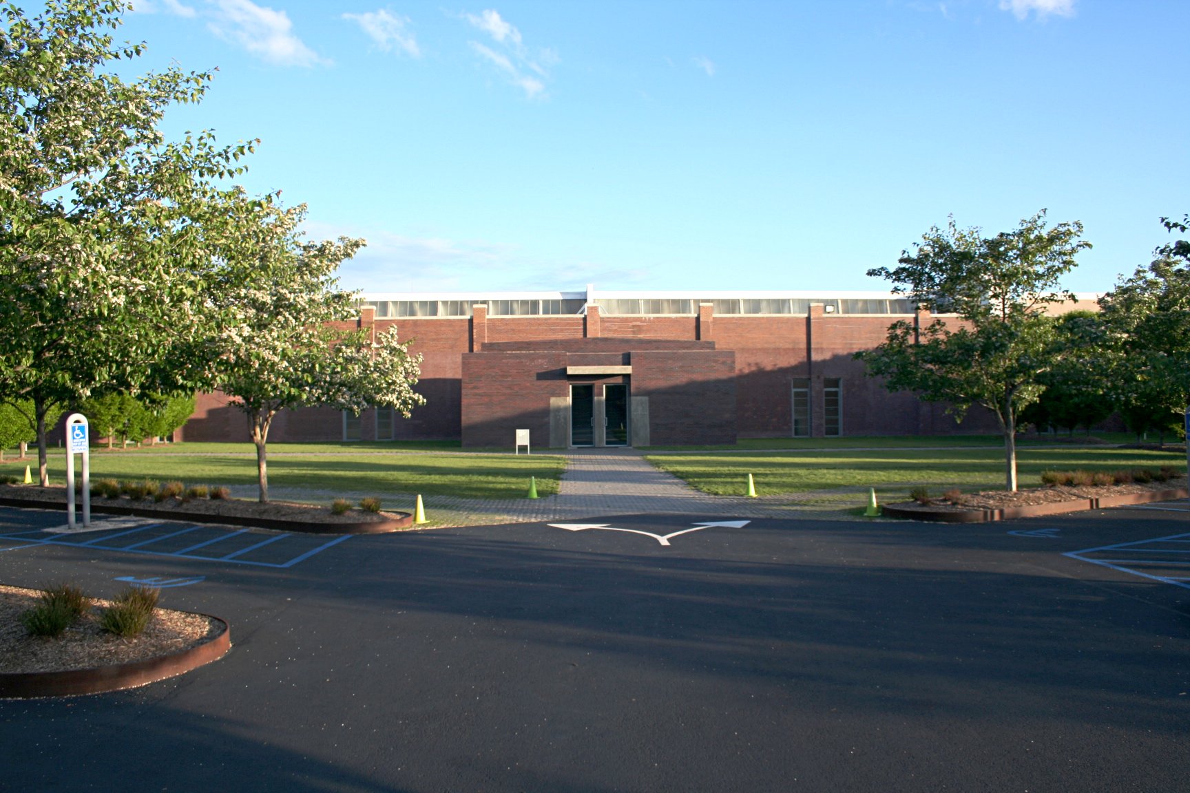 Dia Beacon entrance — the 1929 brick factory facade with restrained signage, the conversion designed by Robert Irwin and OpenOffice