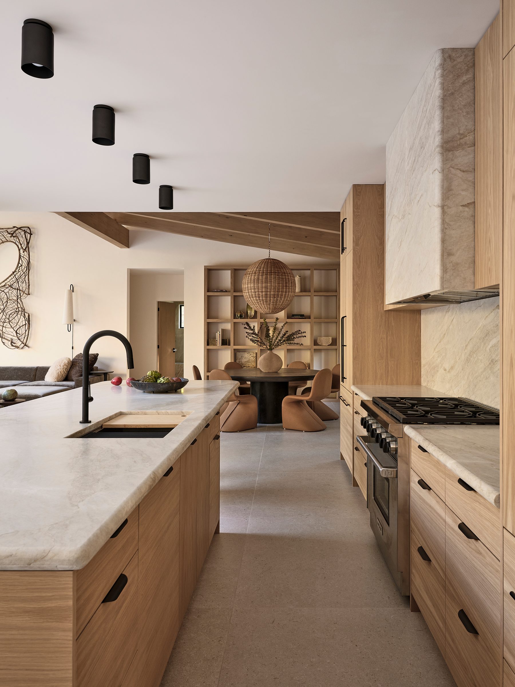 The kitchen from its far end, with the range and open shelving.