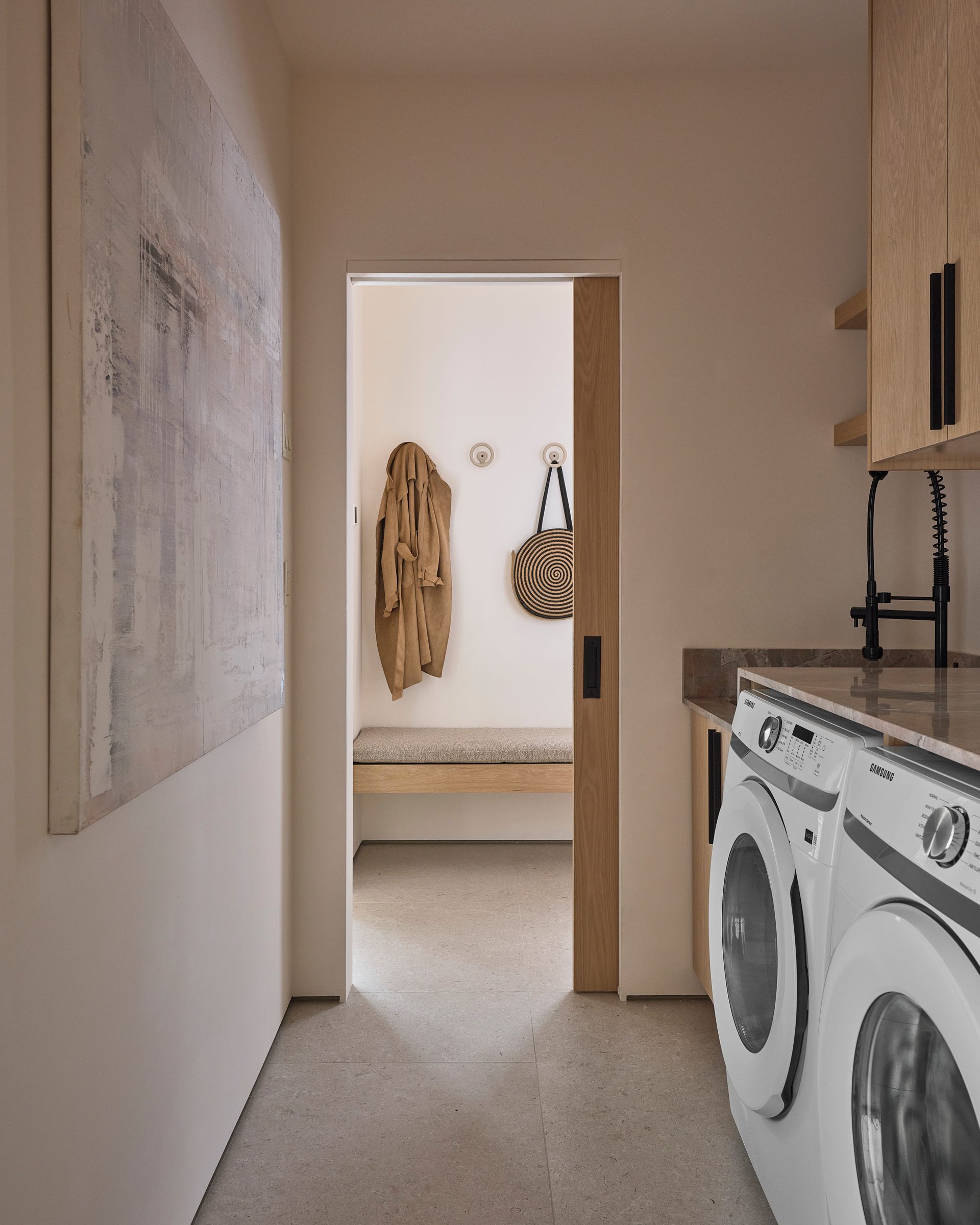 A laundry room with a sink, off the mudroom.