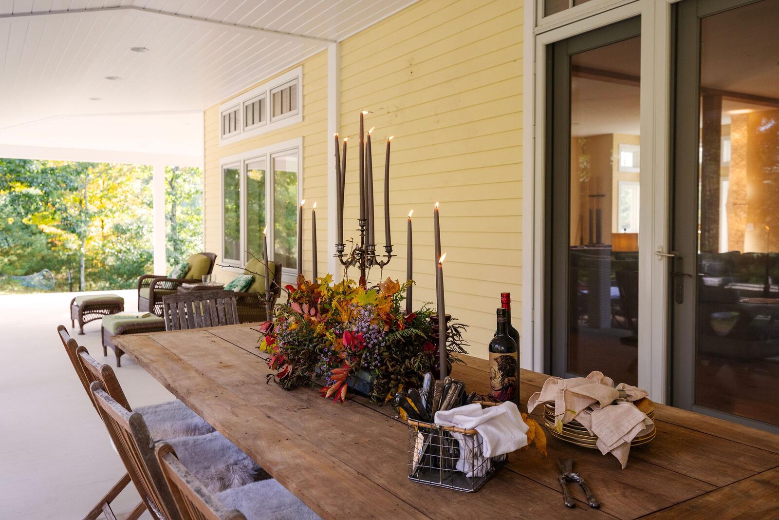 A long table laid on the covered porch.