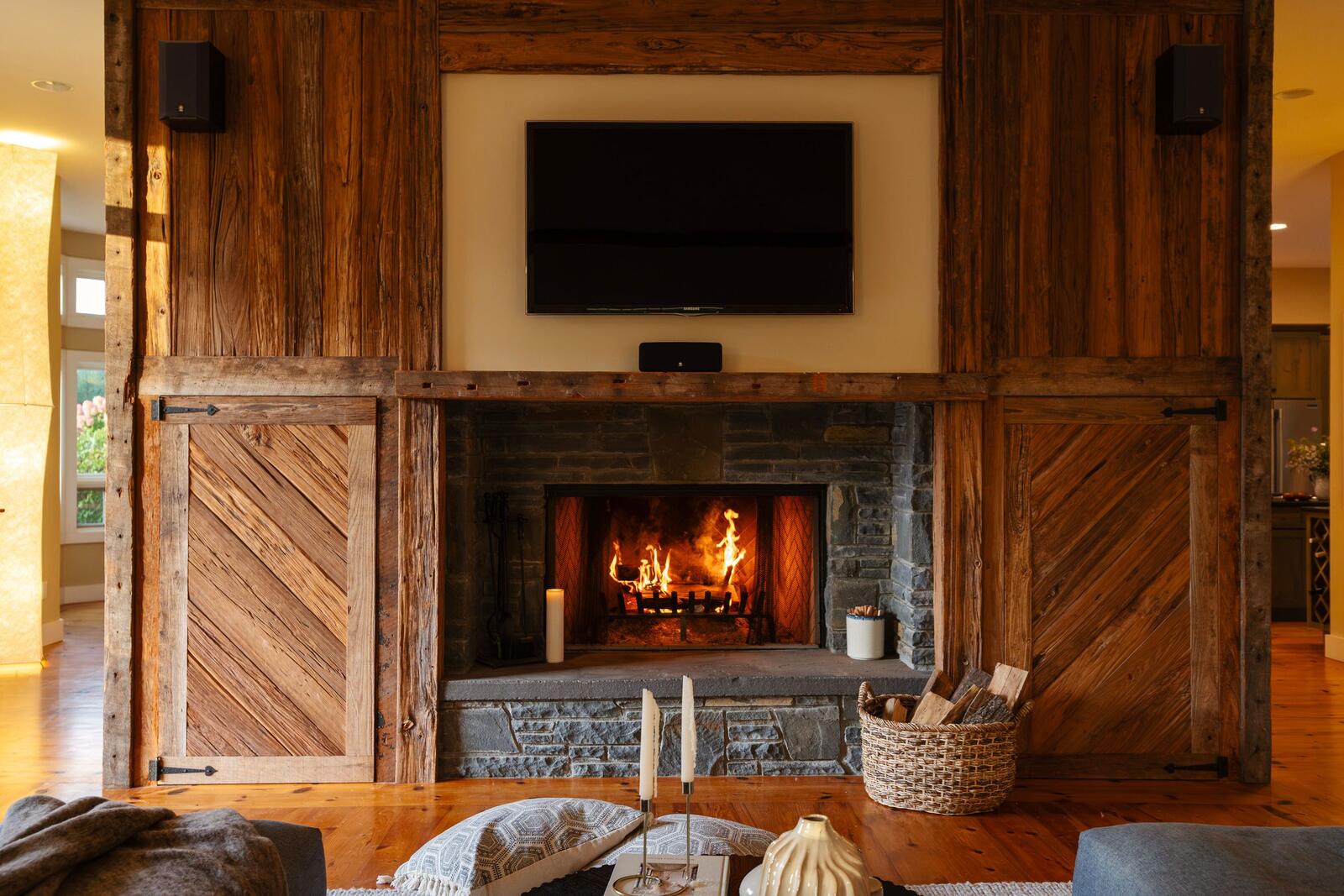 The fire lit in the stone fireplace.