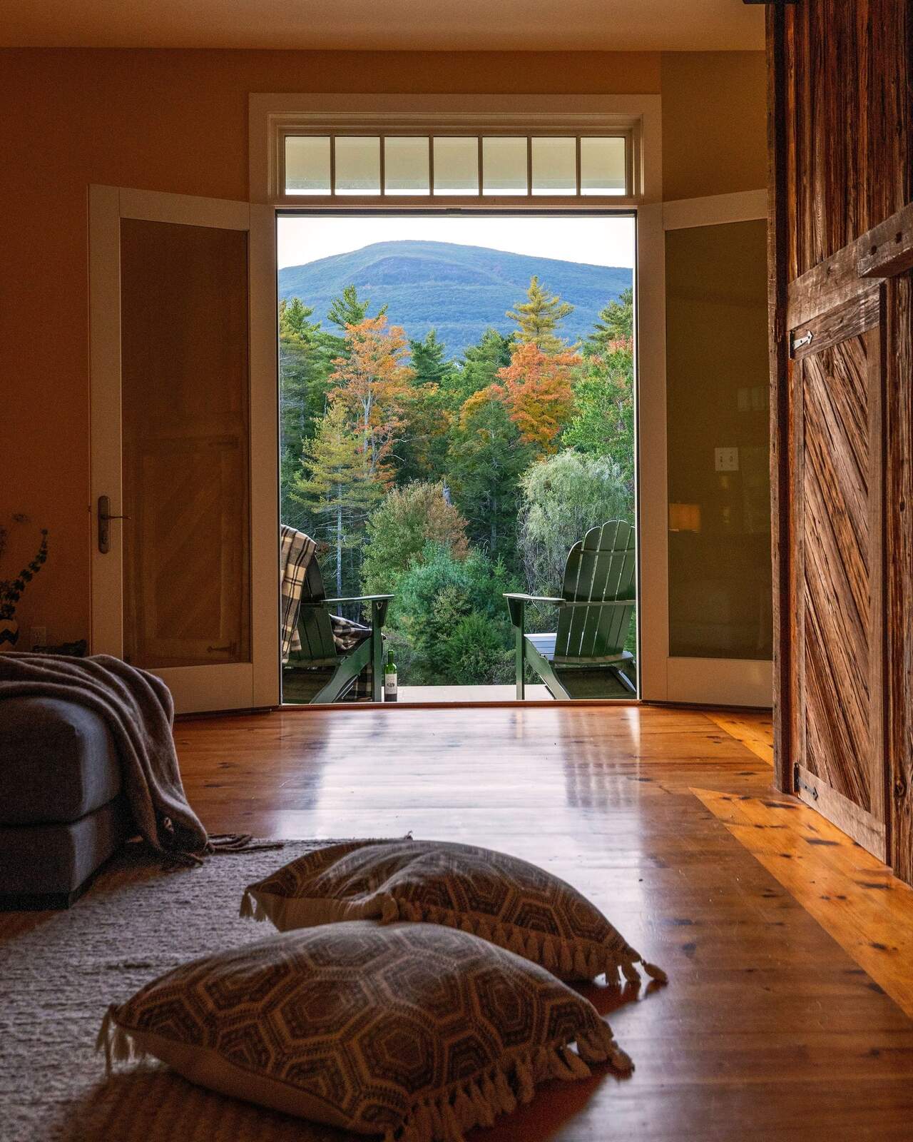 Through the great room to the open doors and the mountain.