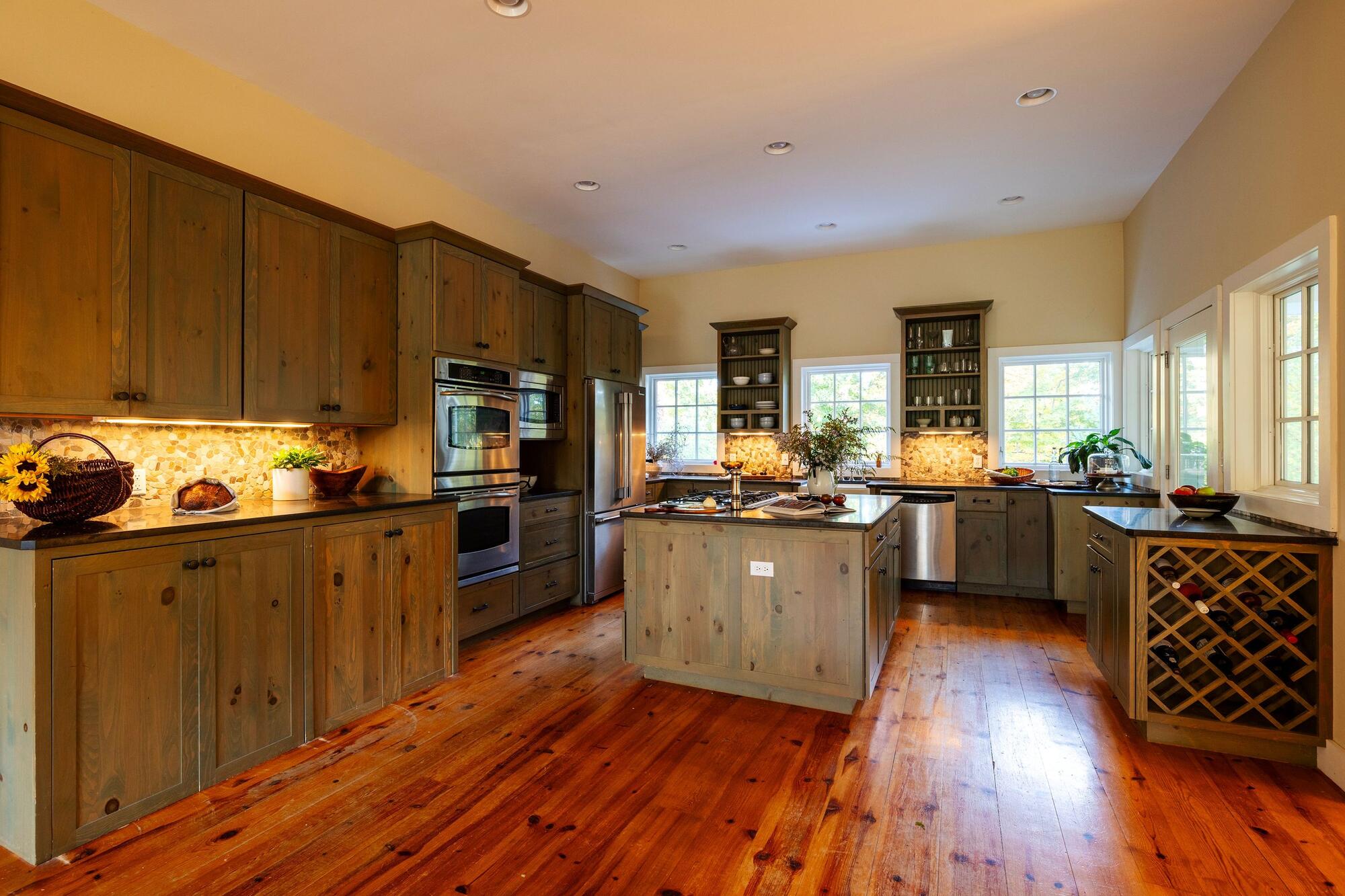 The kitchen, with wood cabinetry and a central island.
