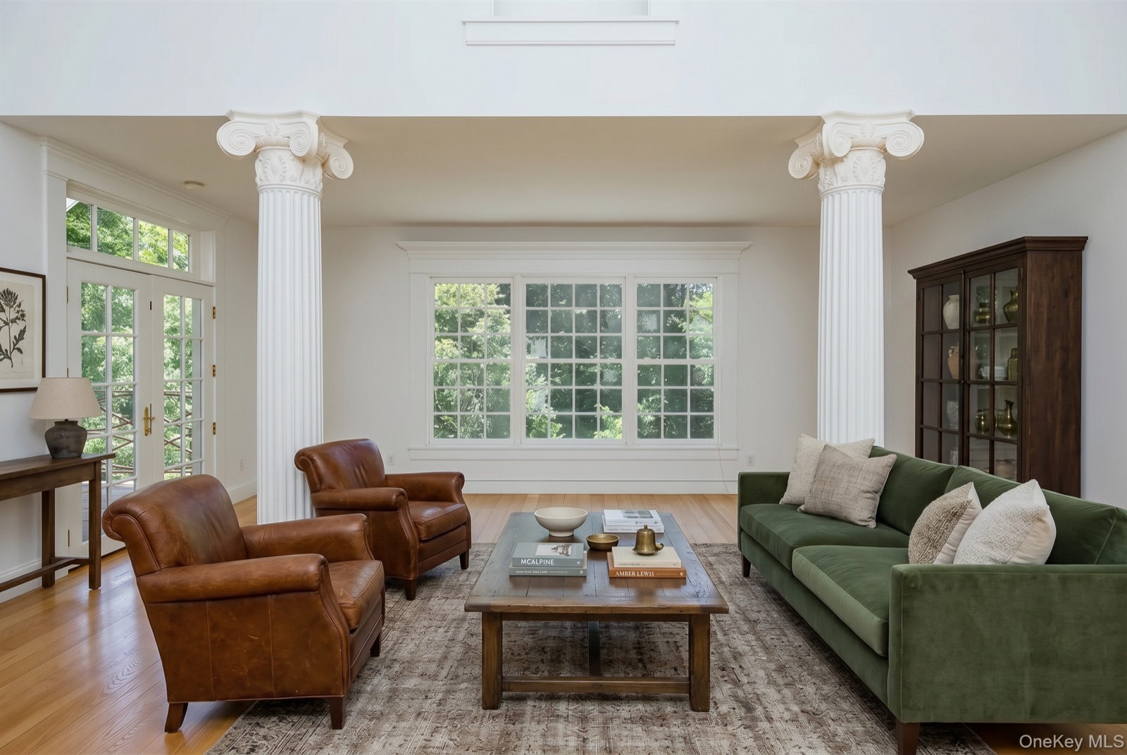 Great room virtually staged with classic luxury furnishings