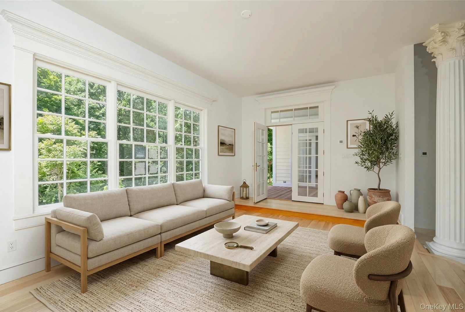Living room virtually staged with warm neutral furnishings