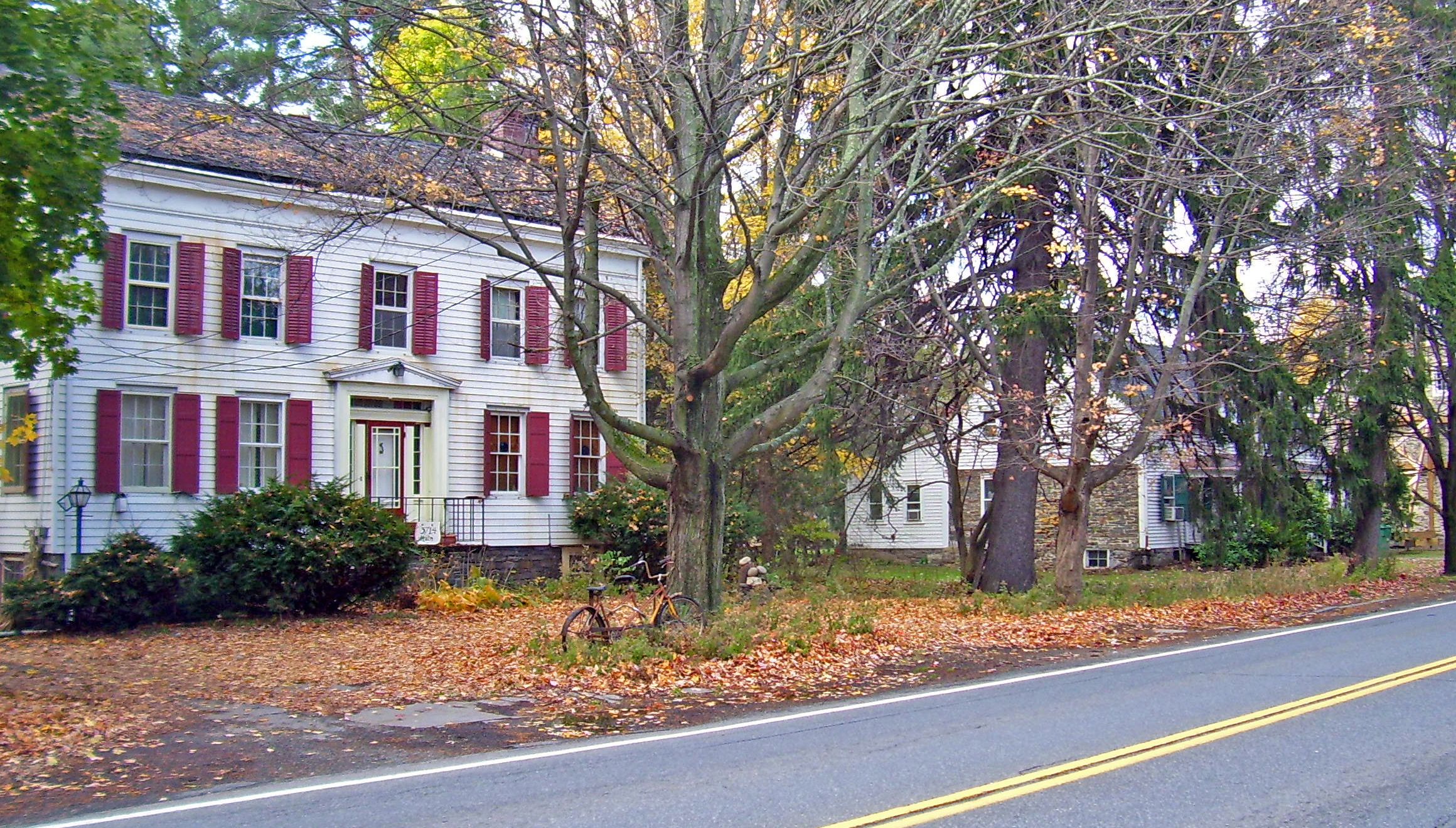 Colonial-era stone houses on Main Street, Stone Ridge — the long row of seventeenth and eighteenth-century gray limestone houses set back from Route 209