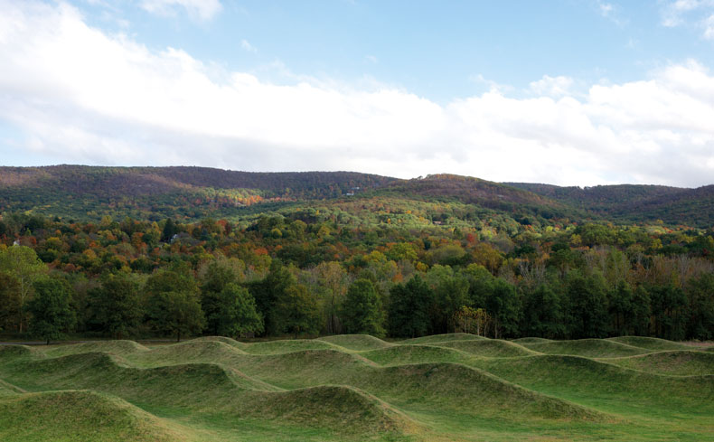 Maya Lin's Storm King Wavefield — rolling earth waves, the Hudson Highlands rising beyond