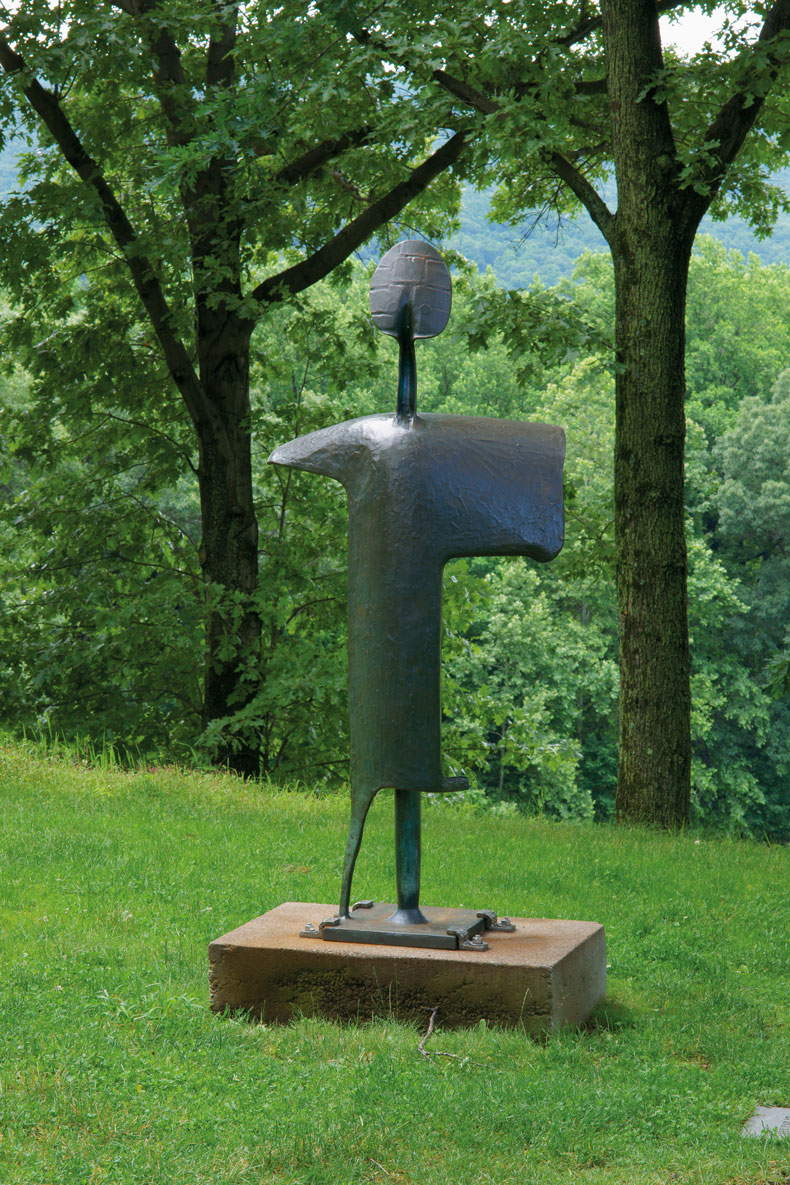 David Smith's Personage of May (1956–57) on a wooded knoll at Storm King, the Hudson Highlands behind